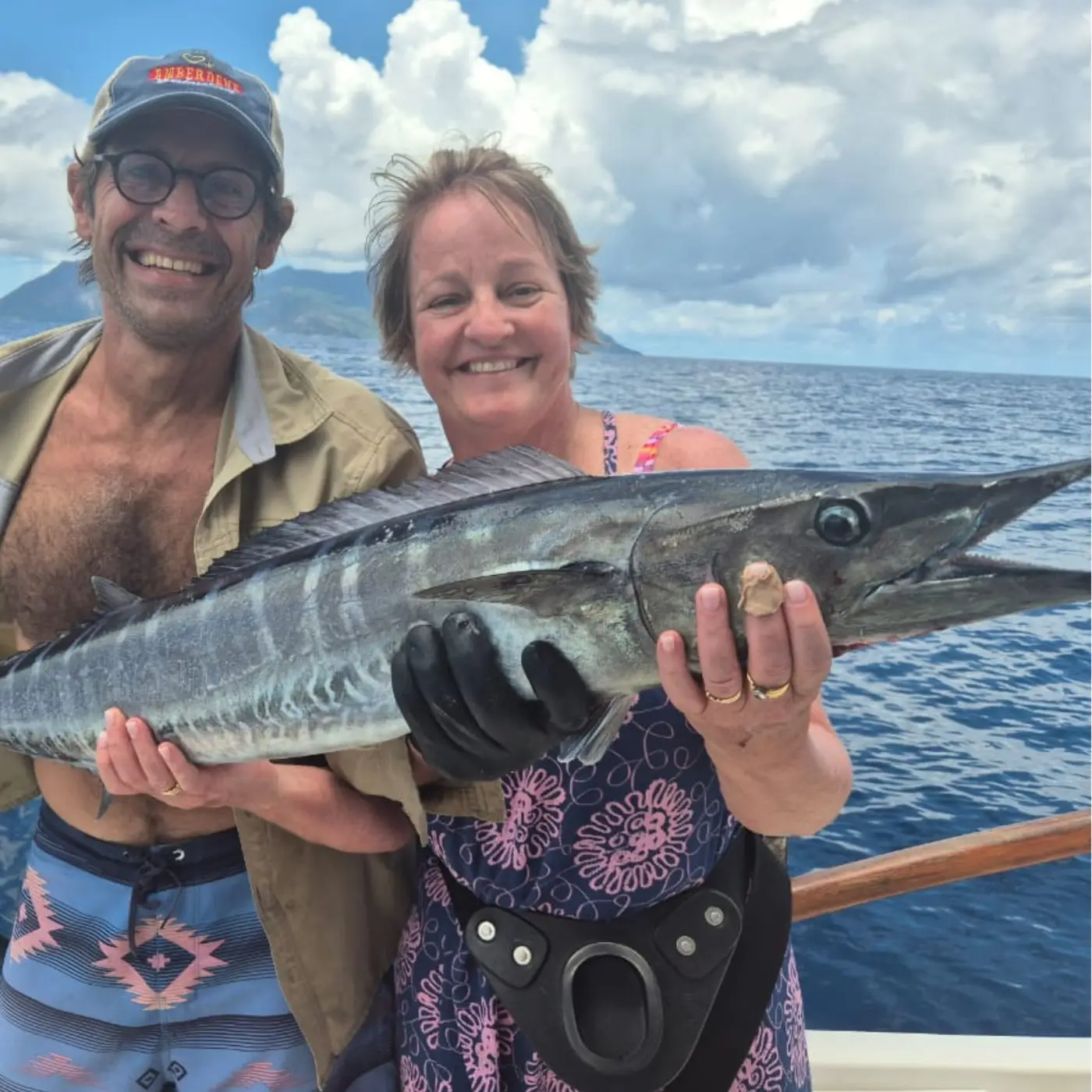 Two anglers holding a wahoo caught during a Seychelles expedition