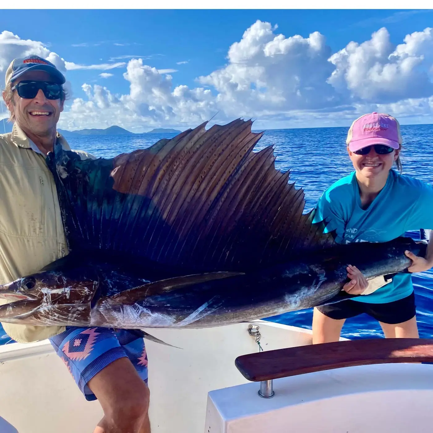 Anglers with a sailfish before release in the Seychelles Outer Islands