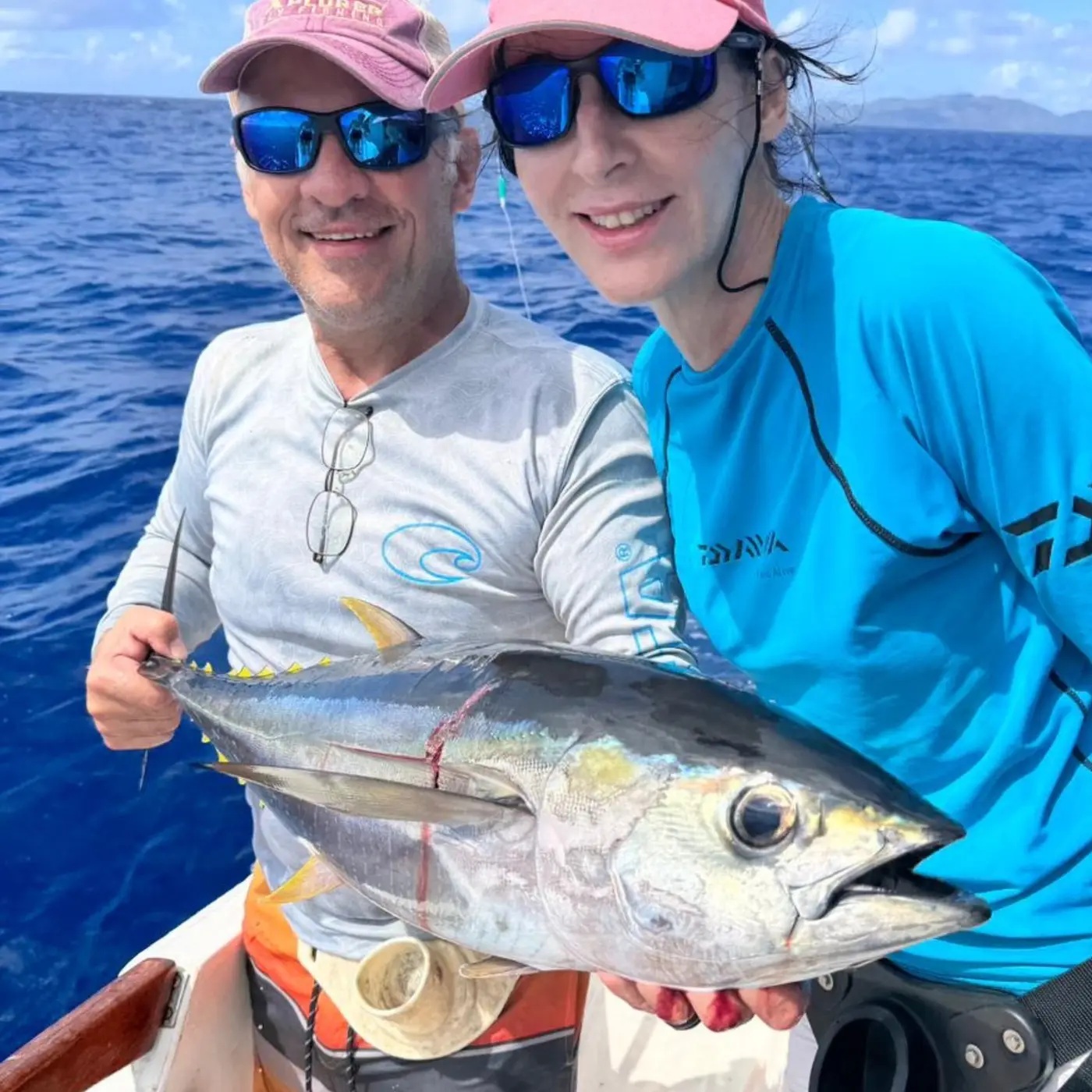 Two anglers with a yellowfin tuna aboard a Seychelles liveaboard